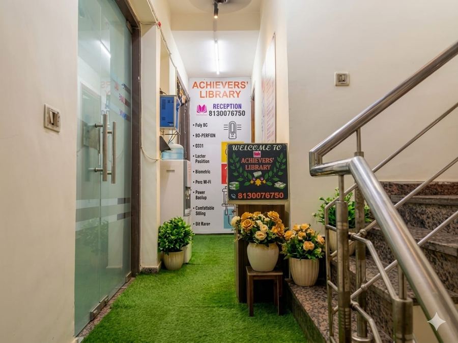 Student deep in study at individual desk — Achievers Library Rohini